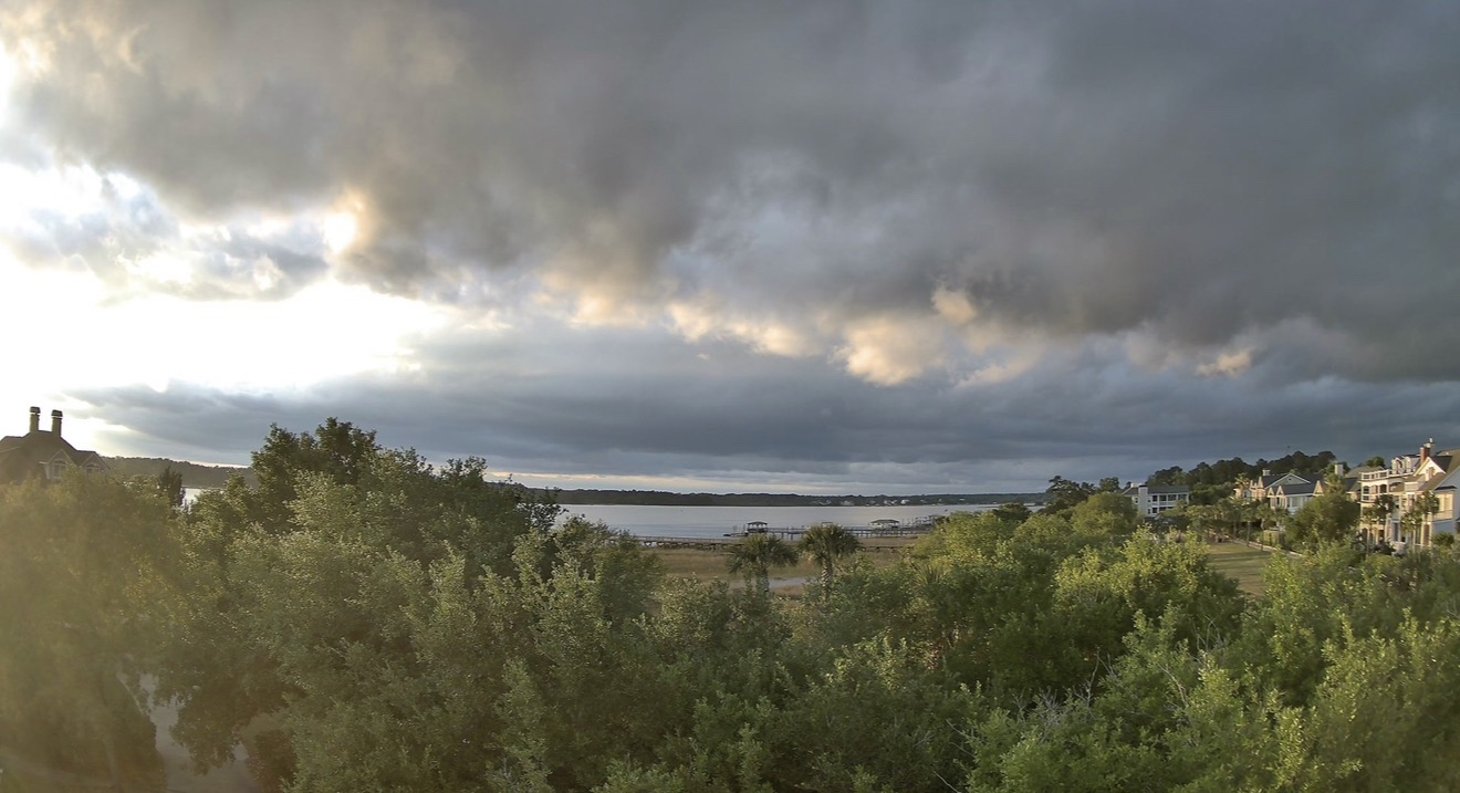 Wide coastal sky view with layered clouds